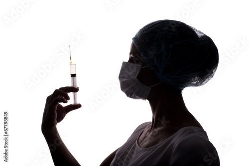 Silhouette of doctor woman using syringe isolated on white
