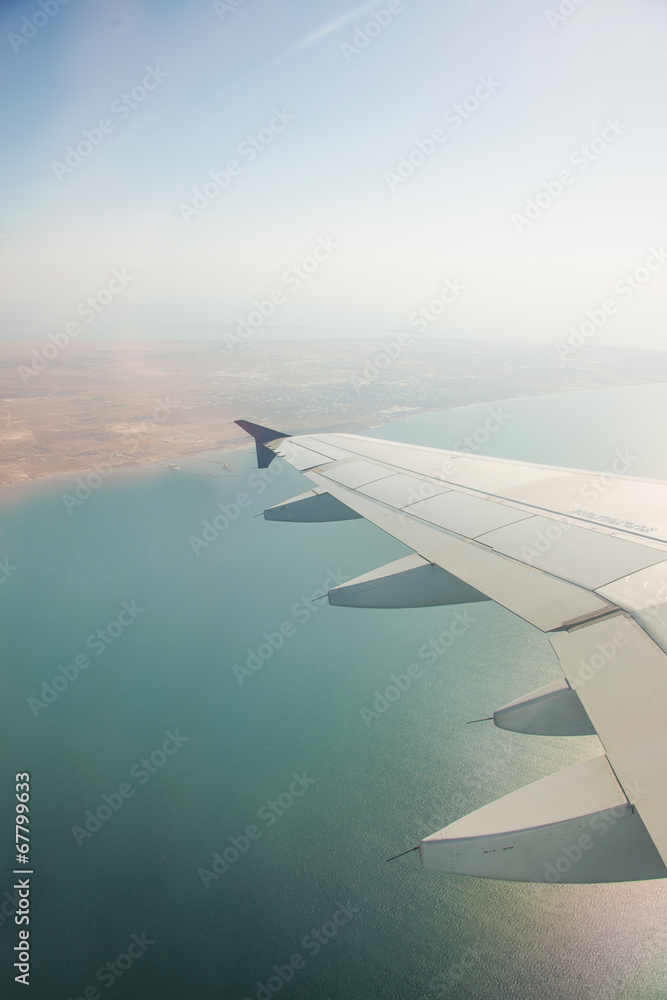 Airplane wing out of window Airplane wing out of window