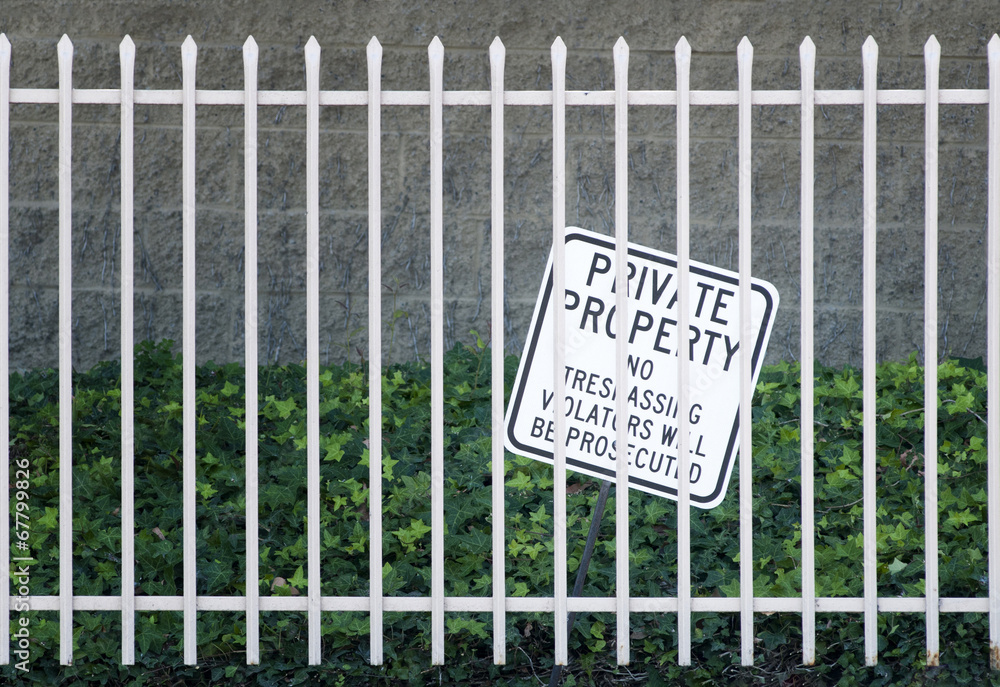 Security Iron fence and no tresspassing sign Security Iron fence and no tresspassing sign