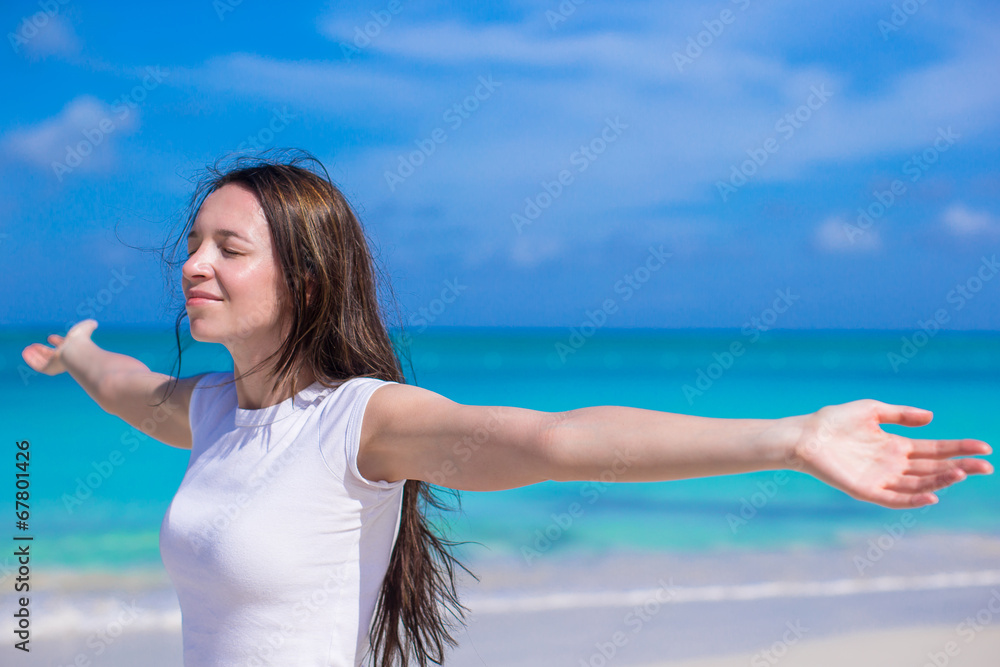 Young woman enjoying vacation on white tropical beach Young woman enjoying vacation on white tropical beach