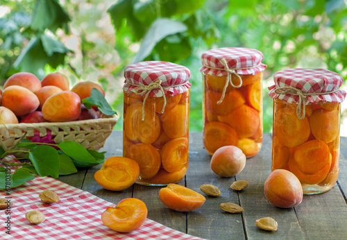 Fresh apricots and jar preserves