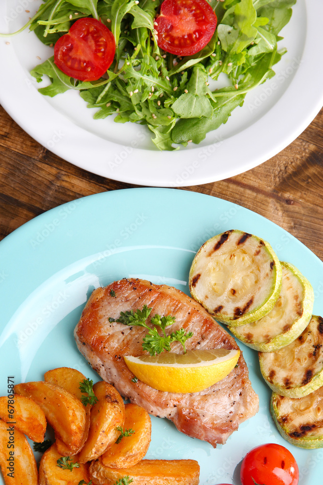 Grilled steak, grilled vegetables and fresh green salad Grilled steak, grilled vegetables and fresh green salad