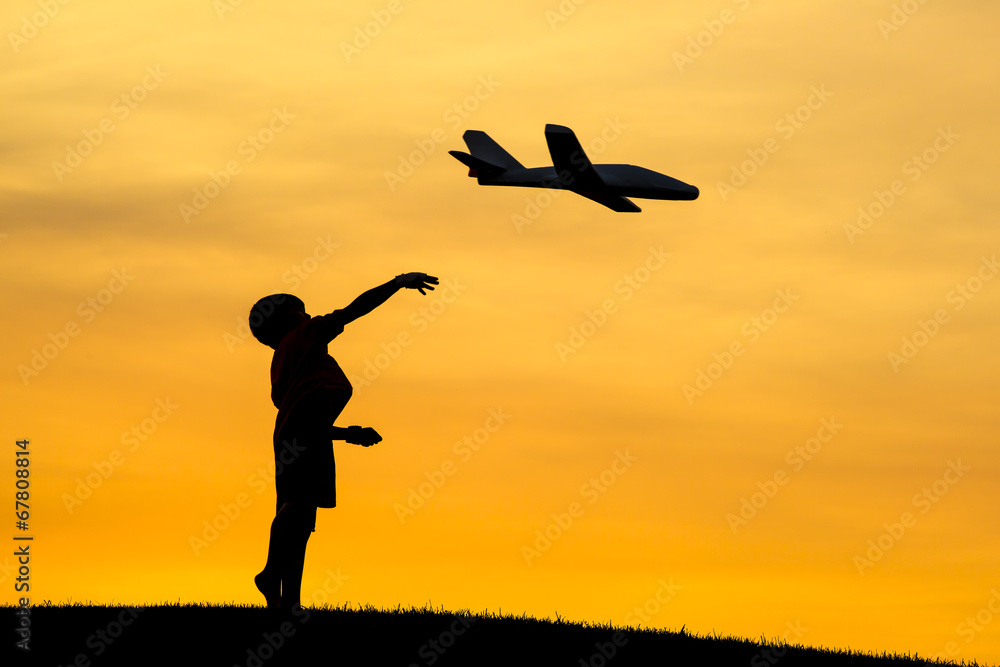 Launching a toy plane. Launching a toy plane.