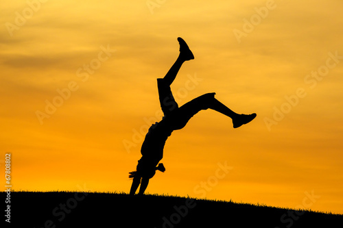 Wallpaper Mural Girl does back bend at sunset. Torontodigital.ca