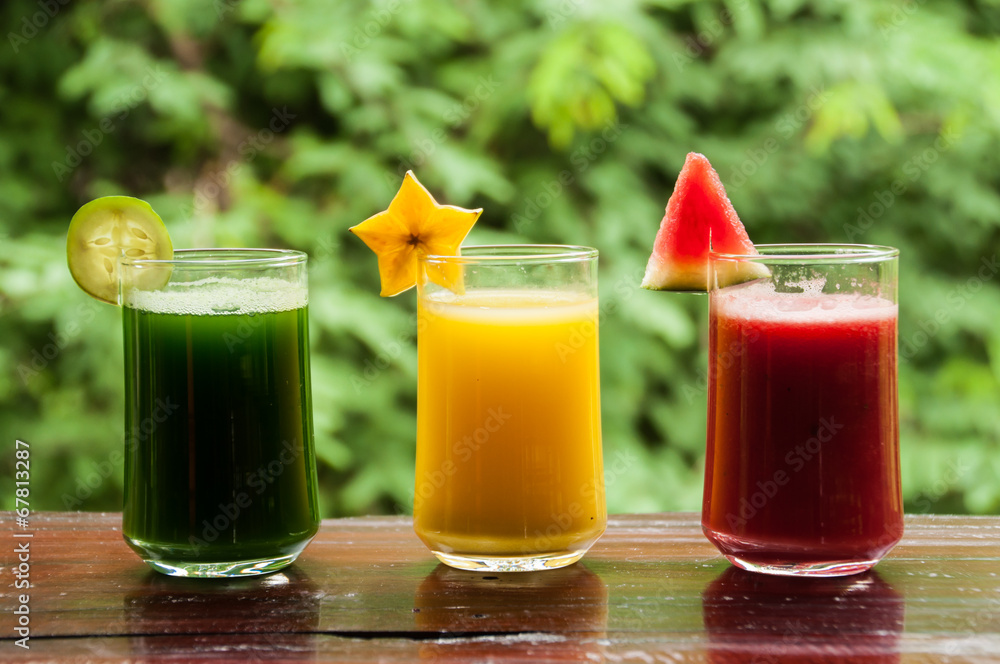 Colorful glasses of fruit juice Colorful glasses of fruit juice