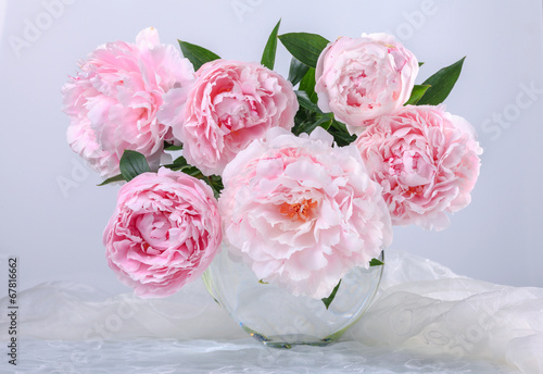 Still life with beautiful pink peonies in green vase