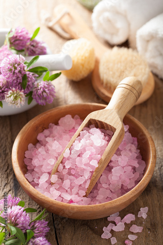 spa with pink herbal salt and clover flowers