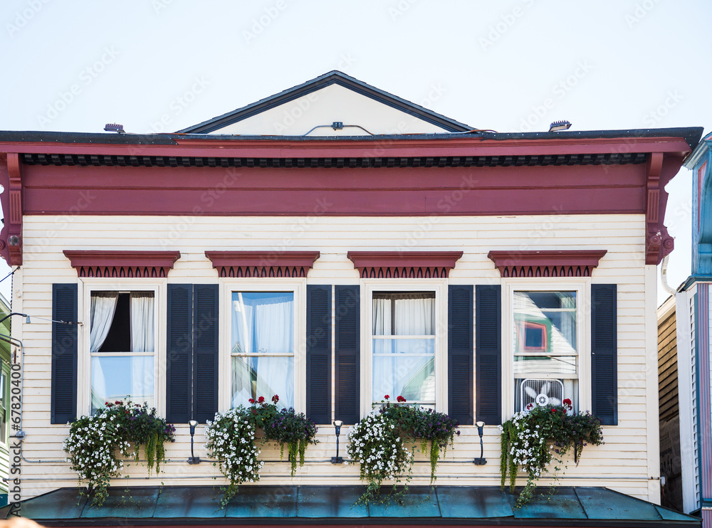 Four Windows on Traditional Facade with Flower Boxes