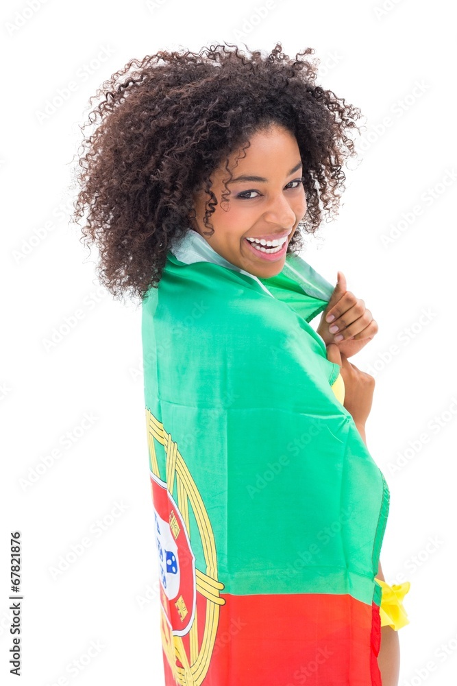 Girl wrapped up in portugal flag smiling at camera Girl wrapped up in portugal flag smiling at camera