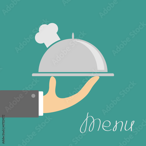 Hand with silver platter cloche and chefs hat. Menu cover. Flat