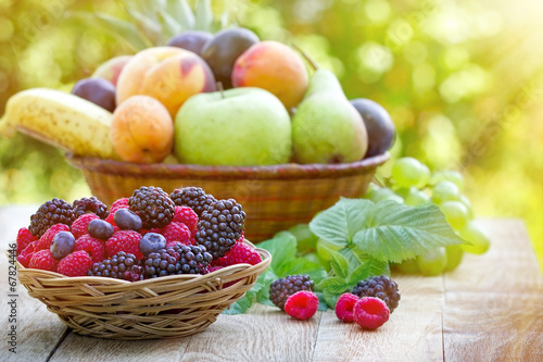 Fresh organic fruits in wicker basket