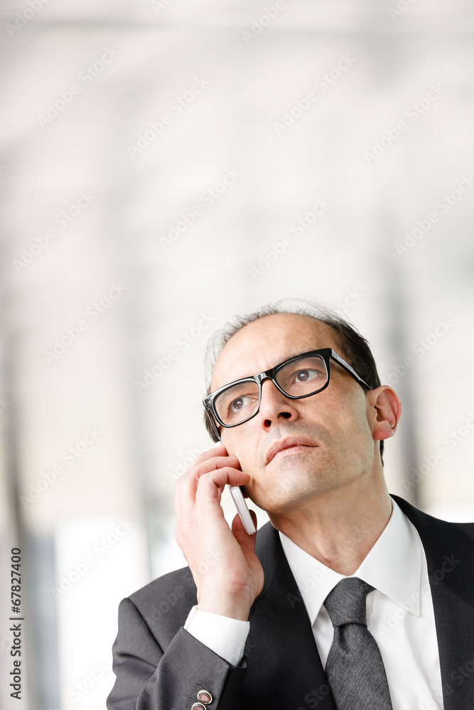 Eyeglasses Adult businessman talking on phone