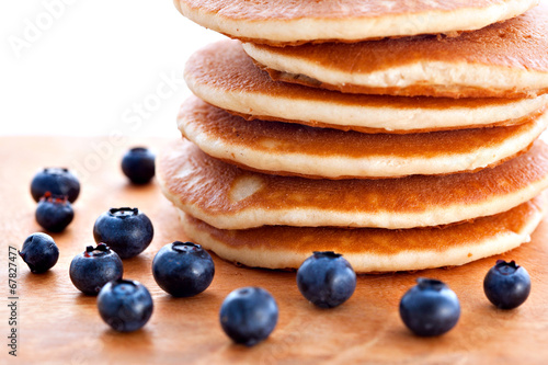 Stack of pancakes with fresh blueberries