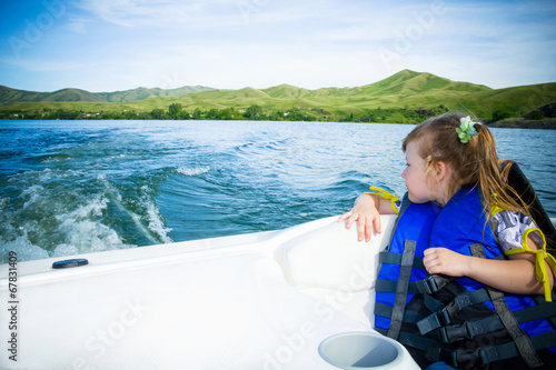 Travel of children on water in the boat