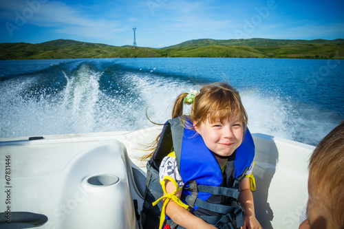 Travel of children on water in the boat