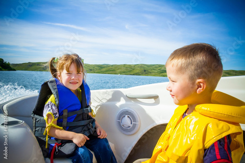 Travel of children on water in the boat