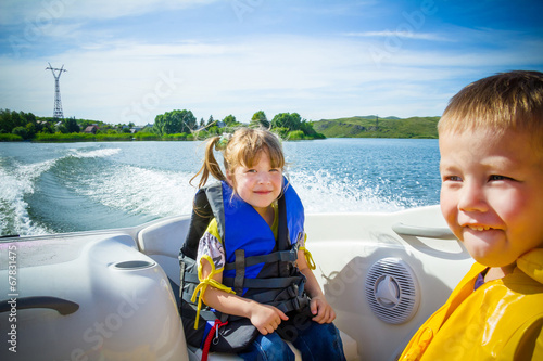 Travel of children on water in the boat
