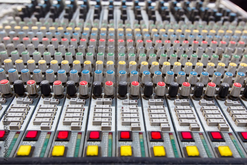 Closeup of buttons of a studio mixer