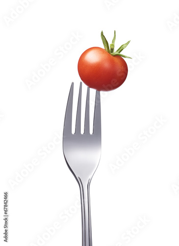 Kleine Tomate auf einer Gabel