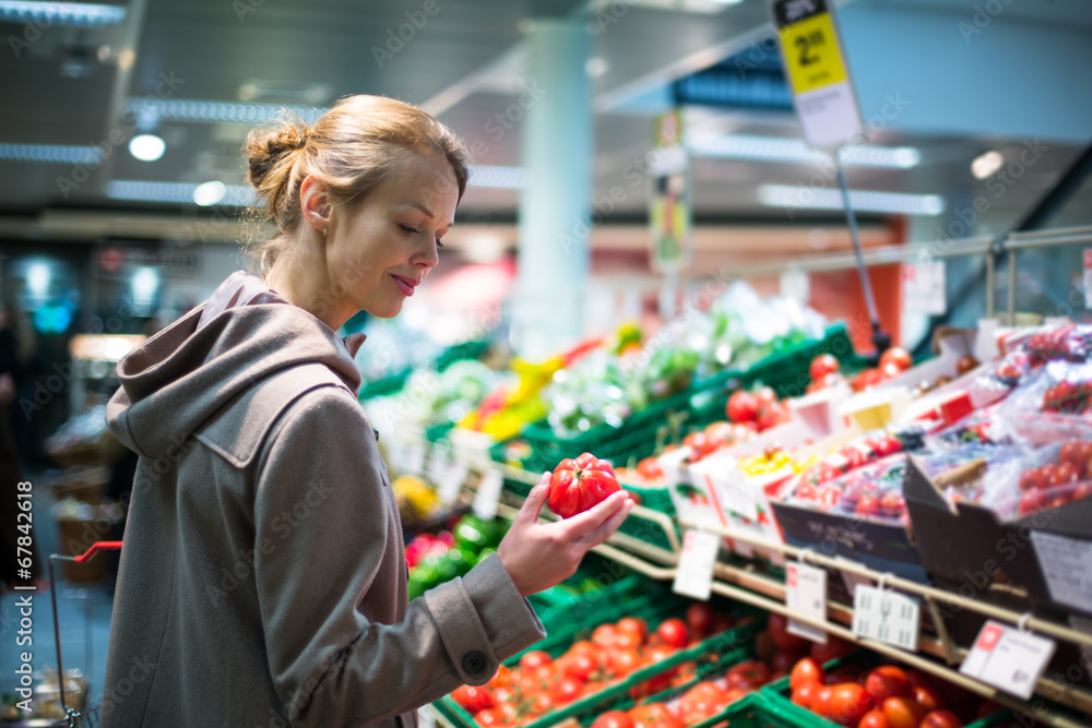 Pretty, young woman shopping for fruits and vegetables
