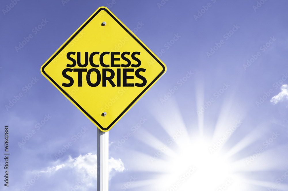 Success Stories road sign with sun background Success Stories road sign with sun background