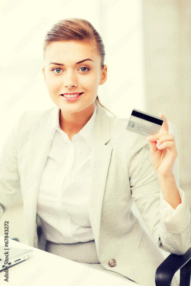 businesswoman with laptop showing credit card businesswoman with laptop showing credit card