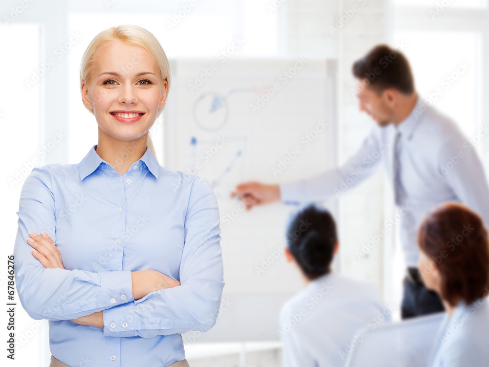 young smiling businesswoman with crossed arms