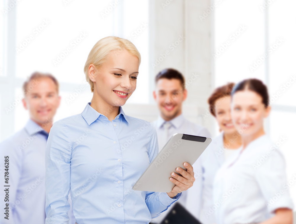 smiling woman looking at tablet pc computer smiling woman looking at tablet pc computer