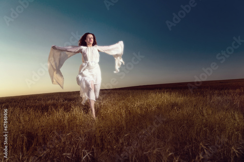 Young dark hair woman in field