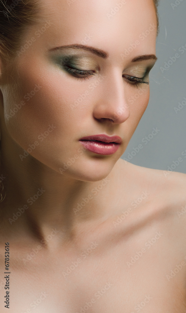 Make-up. Beautiful model with green make up Make-up. Beautiful model with green make up