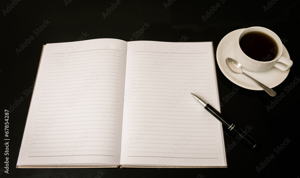 Open a blank white notebook, pen and cup of coffee Open a blank white notebook, pen and cup of coffee
