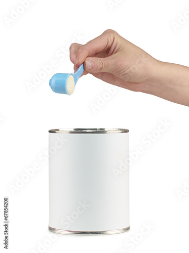 Mother prepares baby milk.