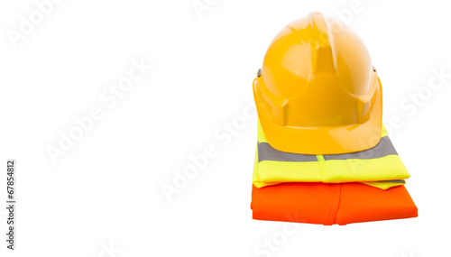 Yellow hard hat and orange and yellow reflective best over white photo