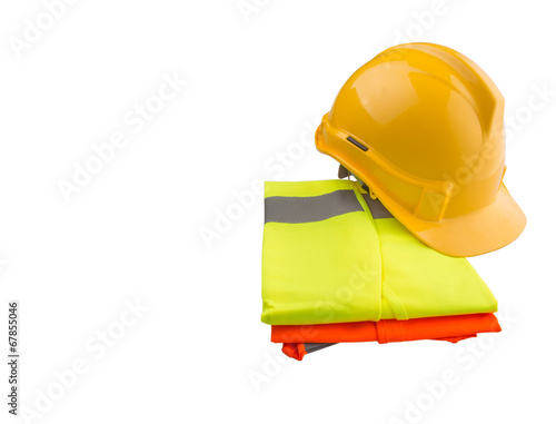 Yellow hard hat and orange and yellow reflective best over white photo