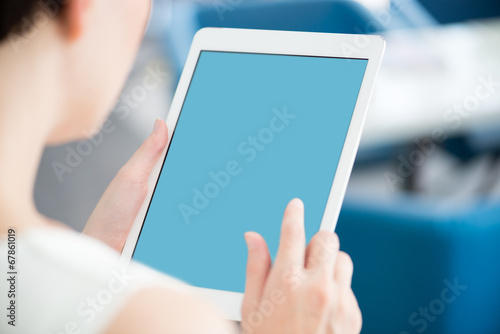 Woman with modern white digital tablet