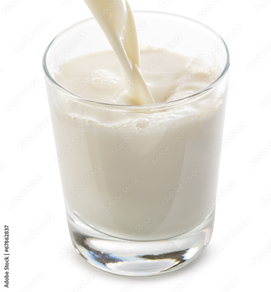 Pouring milk into glass Pouring milk into glass