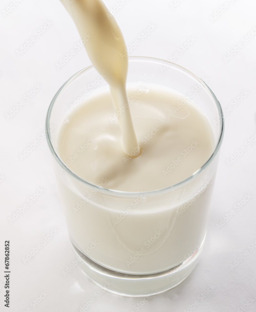 Pouring yogurt into glass Pouring yogurt into glass