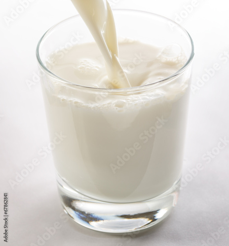 Pouring yogurt into glass