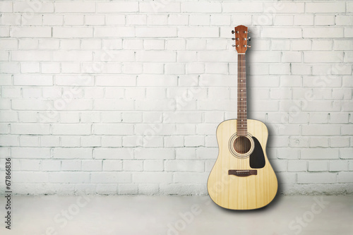 Acoustic guitar in room © Demetrio