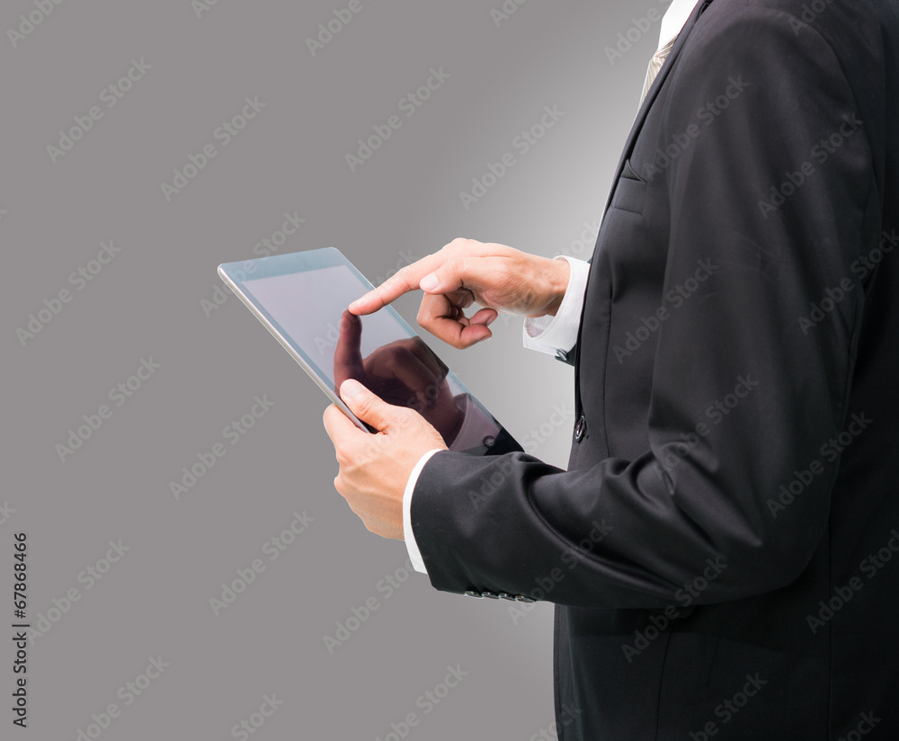 Businessman standing posture hand holding blank tablet isolated Businessman standing posture hand holding blank tablet isolated