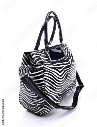 Black handbag on white back...