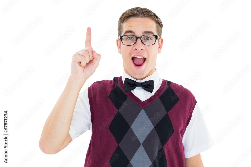 Geeky hipster looking at camera and pointing up Geeky hipster looking at camera and pointing up