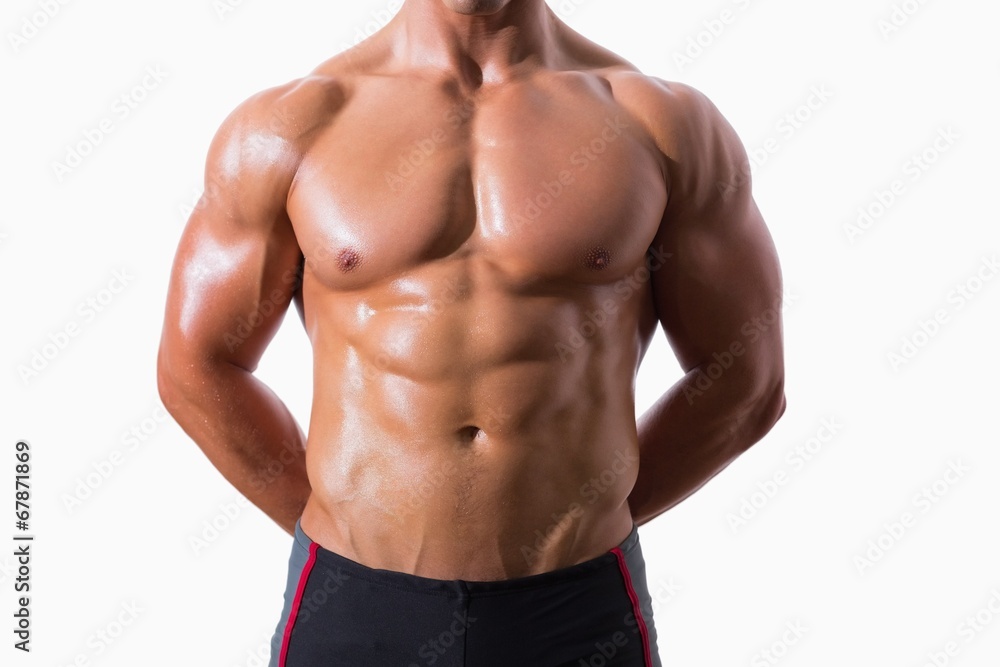 Mid section of shirtless muscular man