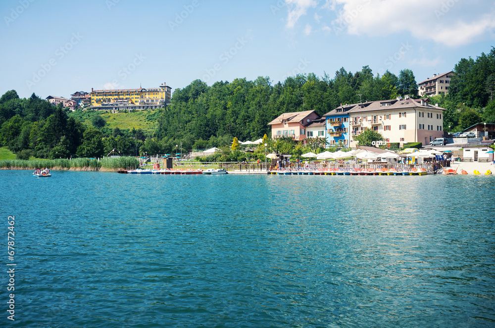 Tourists enjoying Lavarone Lake. Italy.