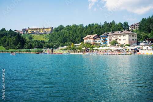 Fototapeta Naklejka Na Ścianę i Meble -  Tourists enjoying Lavarone Lake. Italy.