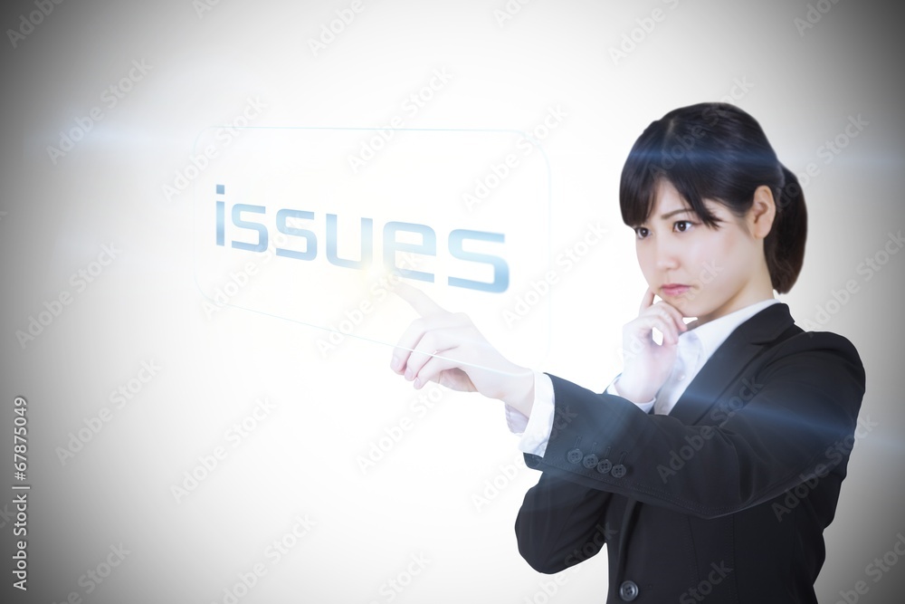 Businesswoman pointing to word issues