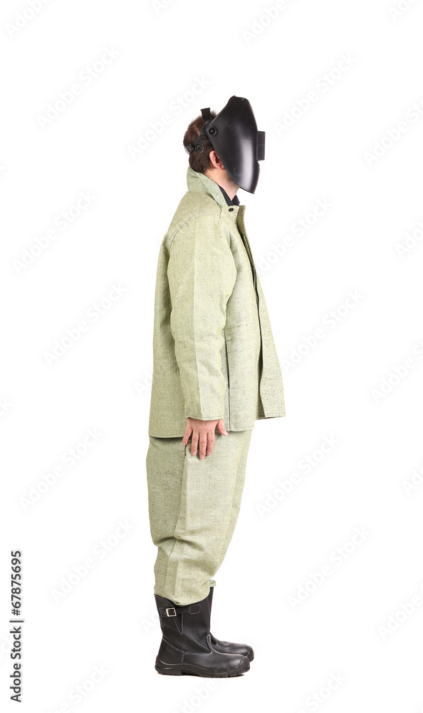 Welder in workwear suit with mask. Welder in workwear suit with mask.