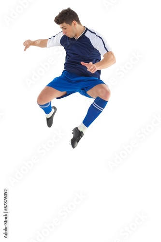 Football player in blue jersey jumping © WavebreakmediaMicro