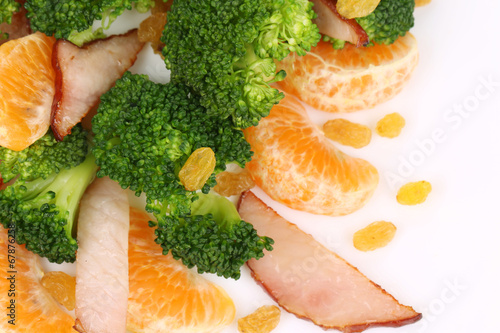 Broccoli salad with smoked ham and orange.