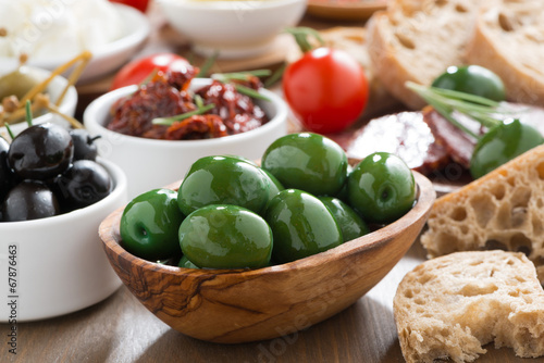 assorted Italian antipasti - olives, pickles and bread